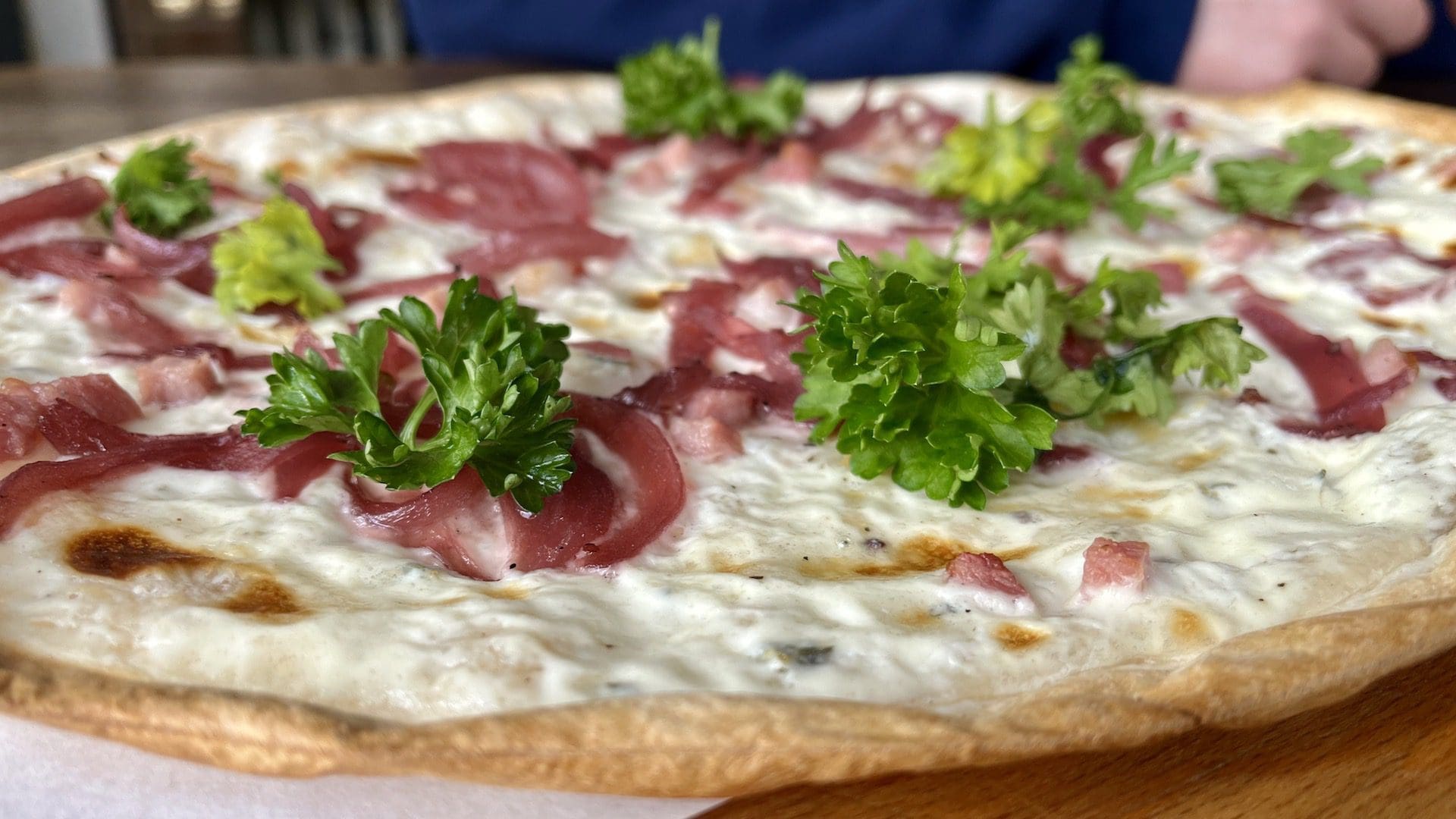 Delicious Flammkuchen classic flatbread from Walk With Us Tours in Berlin Germany